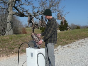 Hunting clothes being washed in portable washer