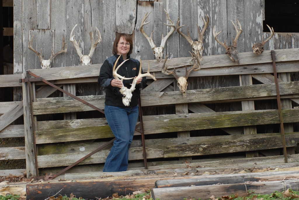 Seven whitetail buck skulls with anters and the woman who found them all 