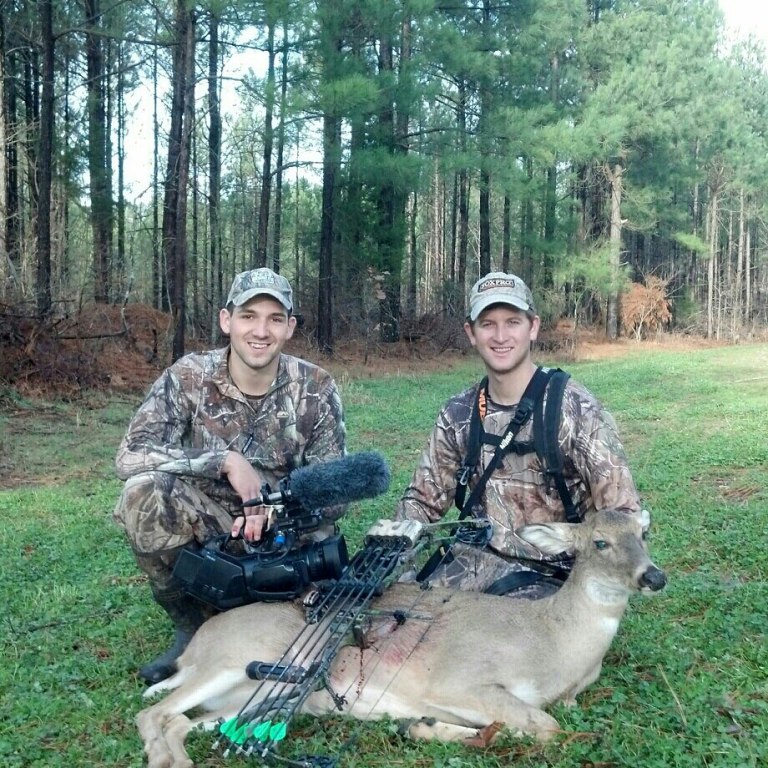 Brian and Adam with a mature doe shot in a clover food plot in Kentucky