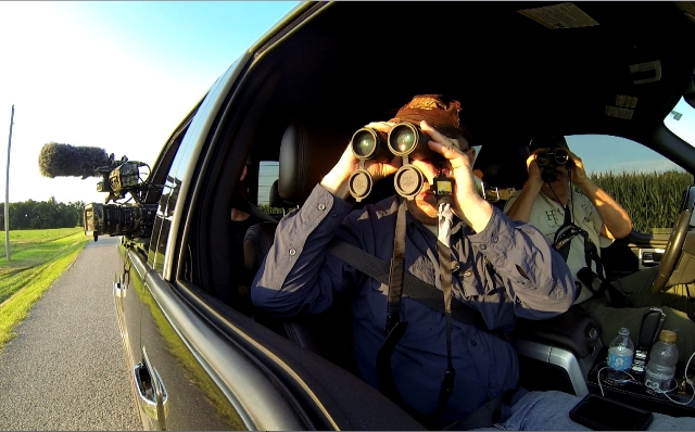 Using Nikon binoculars to scout deer in bean field