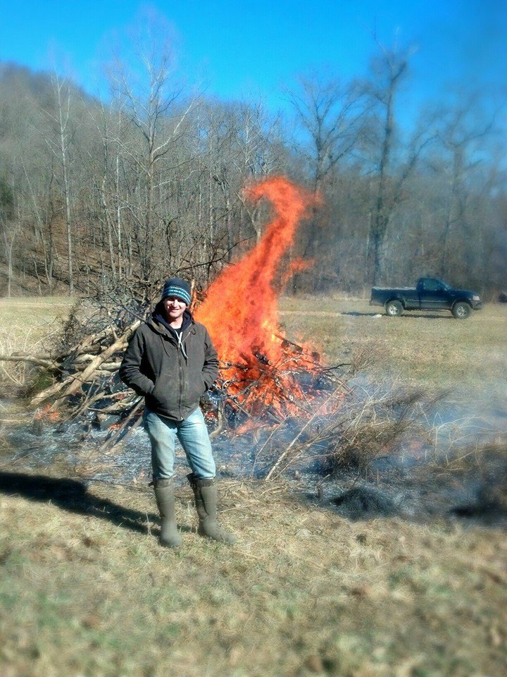 A burning brush pile in the center of a food plot