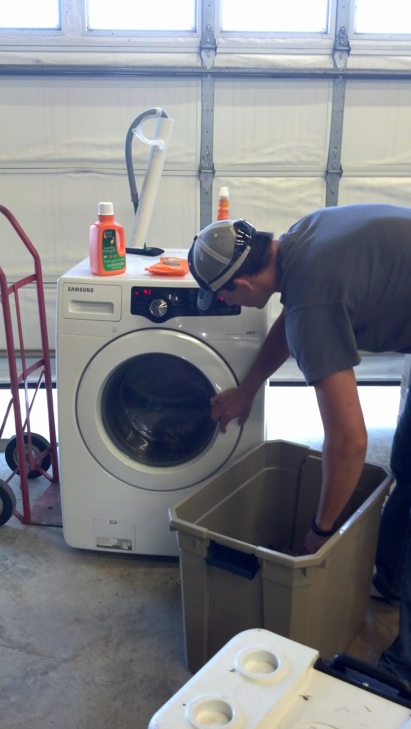 Adam washes clothse with Dead Down Wind in preparation for hunting season.