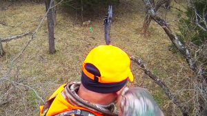 Heath Martin takes aim at a coyote with his bow.