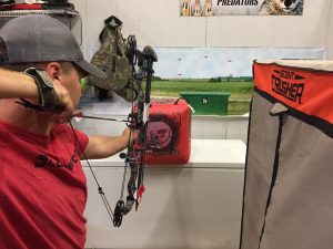 Clay practices shooting a target at close range