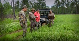 Grant standing in a clover food plot