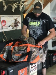 Daniel fills a Scent Crusher Ozone Tote with hunting gear.
