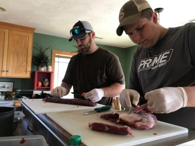 Trimming connective tissue off of venison