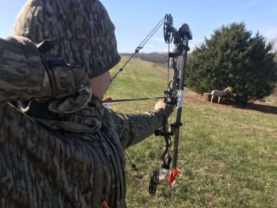 Tyler practices shooting while wearing cold weather gear