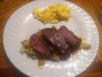 Venison steak with scrambled eggs and potatoes for breakfast