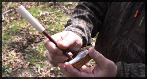 Demonstrating how to hold a turkey call