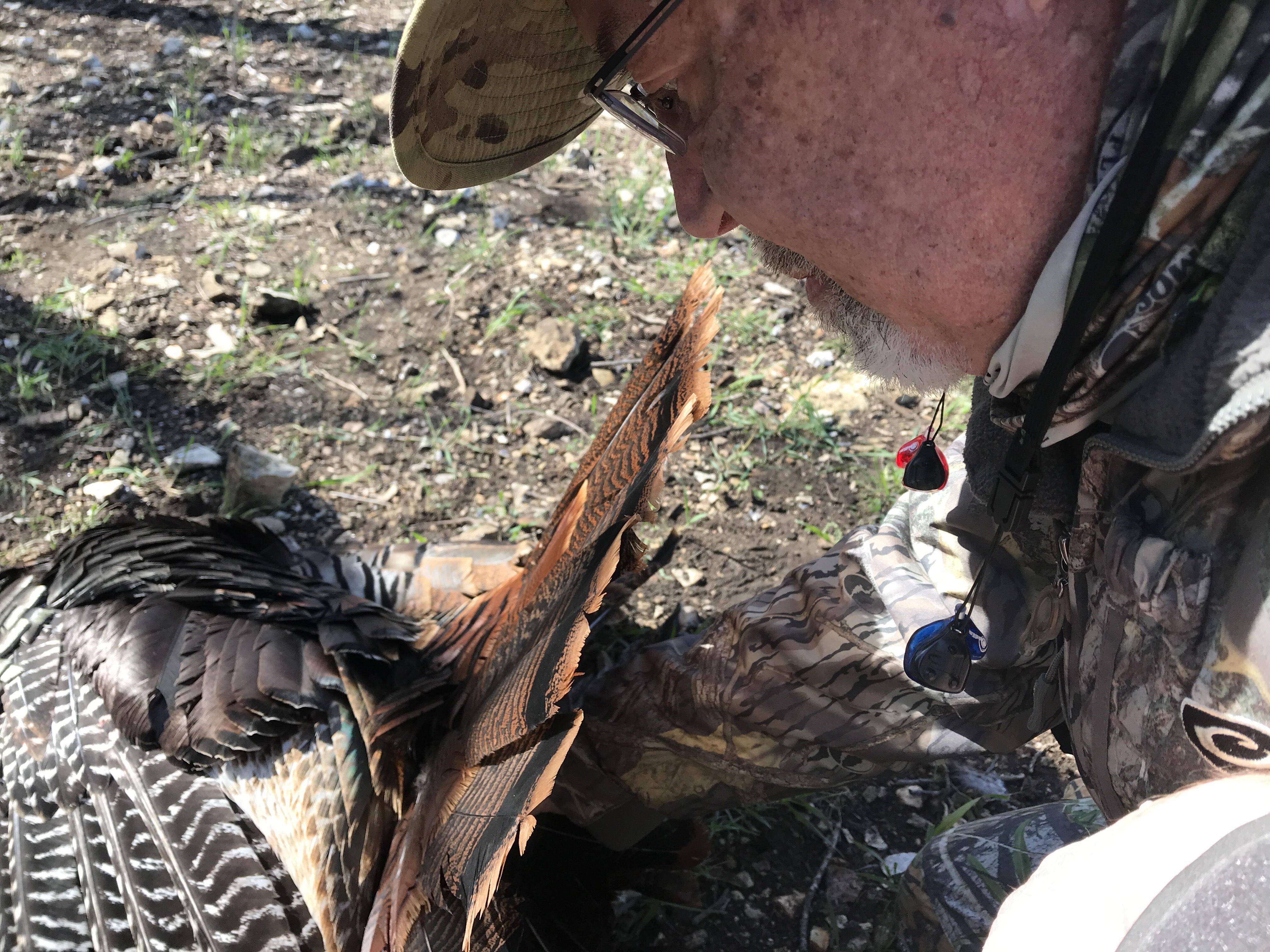 hunter with turkey and hearing protection