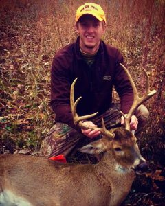 hunter with 8 point whitetail deer buck