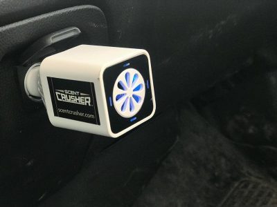 A Scent Crusher Ozone Go plugged into our work truck