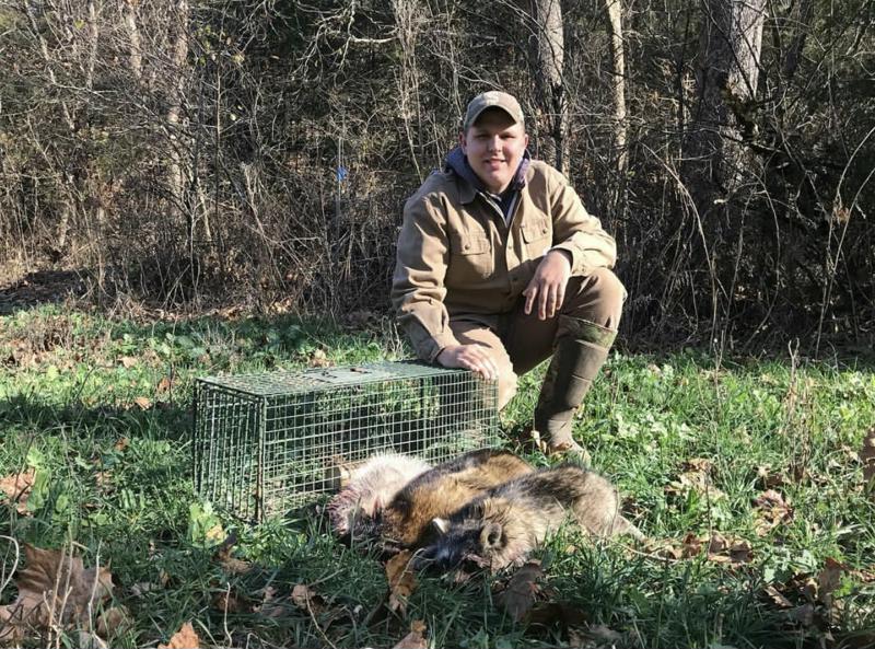 Tyler with Duke cage trap and critters