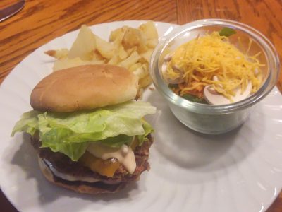 A grilled venison burger on a plate