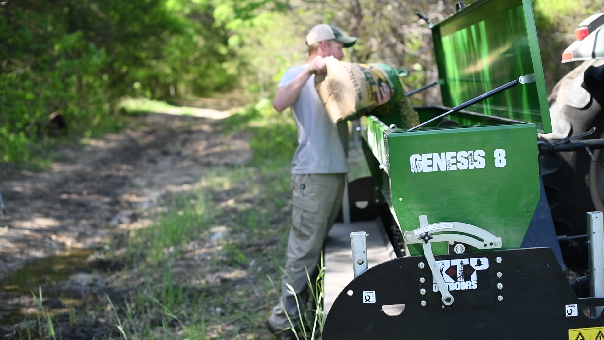 man loading eagle seed soybean mix into a Genesis No-till drill