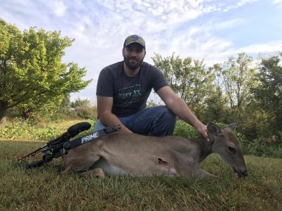 hunter with a doe harvested with a Prime bow
