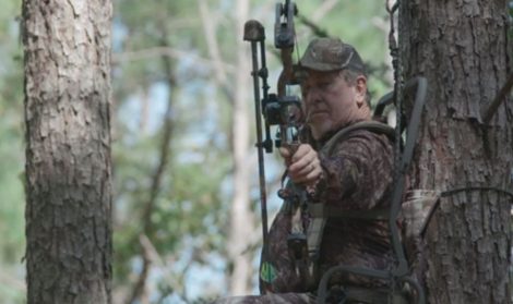 bow hunter in treestand